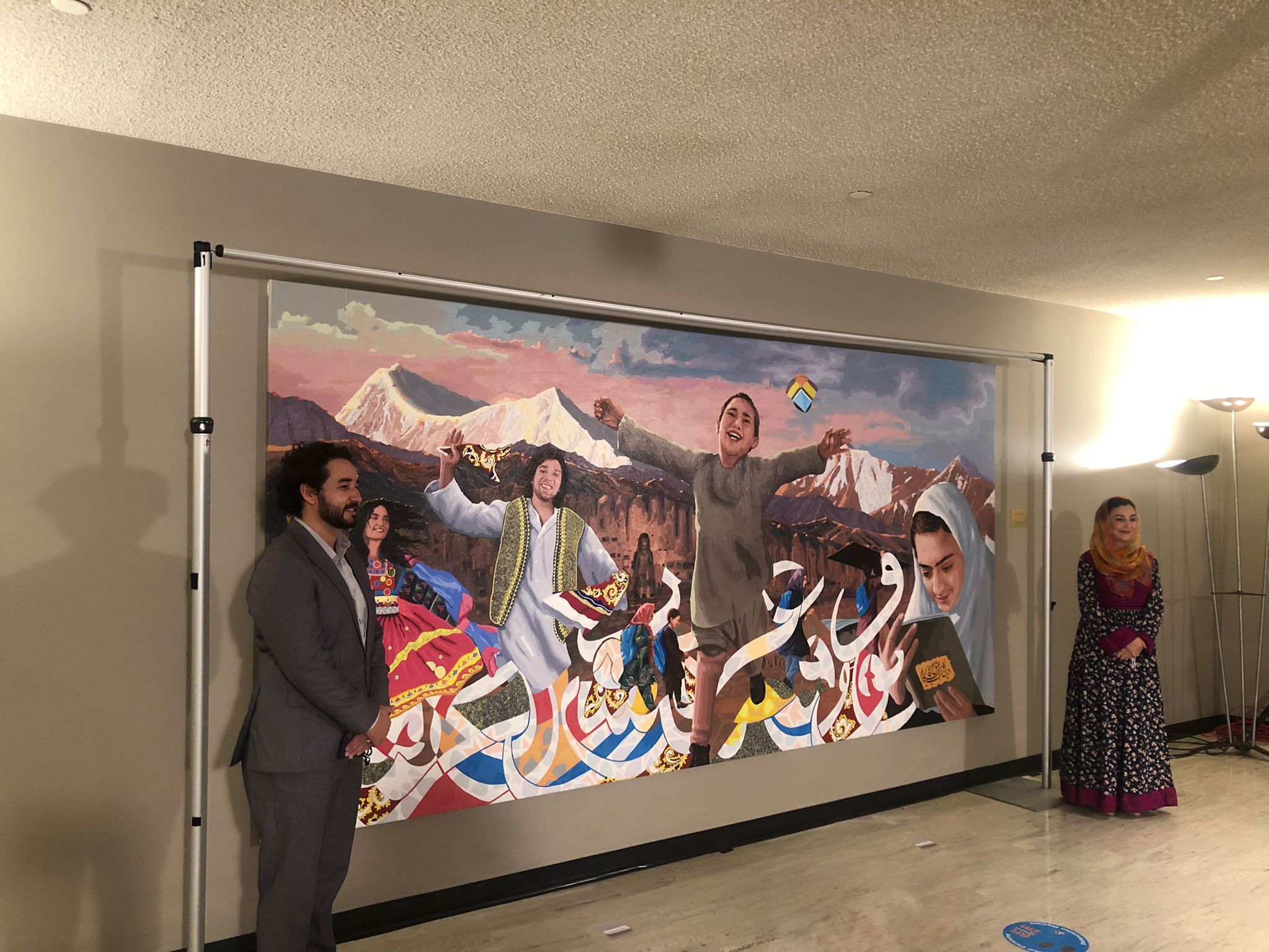 “This painting is also dedicated to all UN colleagues, national and international staff, who have tirelessly worked in Afghanistan. The girls carrying their blue UNICEF backpacks is exactly what I grew up with--our strides and determination for education with the solidarity of international community/UN,” added Raz.
